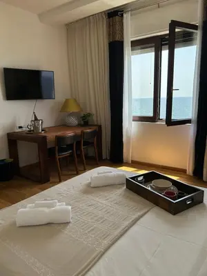Letto o letti in una camera di Bed and Breakfast Onde Beach Poetto