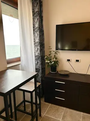 TV o dispositivi per l'intrattenimento presso Bed and Breakfast Onde Beach Poetto
