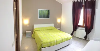 Letto o letti in una camera di B&B Hibiscus