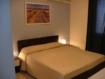 Letto o letti in una camera di B&B Hibiscus