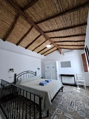 Letto o letti in una camera di SA DOMU ANTIGA - Casa Indipendente in Centro Storico
