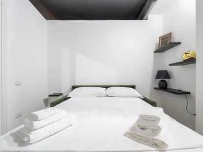 Letto o letti in una camera di Ex Magazzini