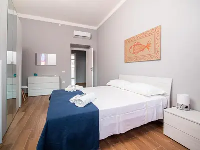Letto o letti in una camera di Maestrale Apartment