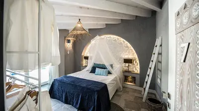 Letto o letti in una camera di CapoBlu Hotel