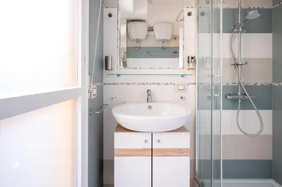 Bagno di Kalbia Rooms managed by HolyDaisy - Renovated, functional, intimate and more