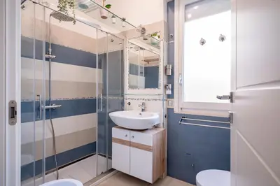 Bagno di Kalbia Rooms managed by HolyDaisy - Renovated, functional, intimate and more