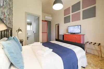 Letto o letti in una camera di GUEST HOUSE SONNINO 37 Cagliari