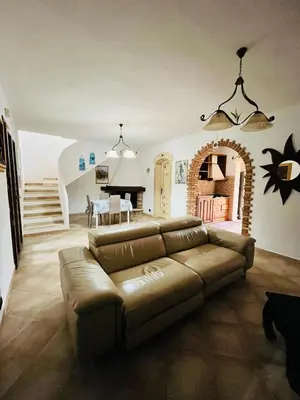 Area soggiorno di Angelica's beachside apartment