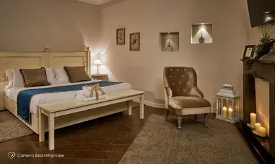 Letto o letti in una camera di Albergo Diffuso Birkin Castello