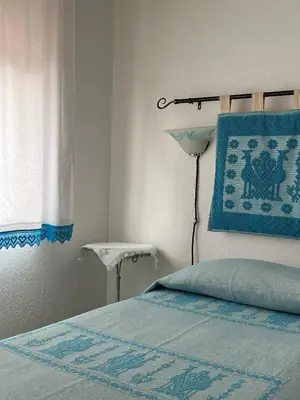 Letto o letti in una camera di Casa Rosa