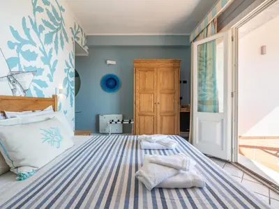 Letto o letti in una camera di Villa Elicriso