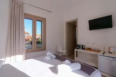 Letto o letti in una camera di Guest House Deidda - TS ROOMS B&B
