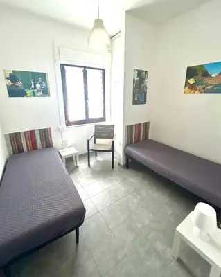 Letto o letti in una camera di Villa Annalisa