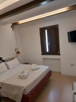 Letto o letti in una camera di La casetta Guest House Oristano