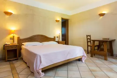 Letto o letti in una camera di Residence Baia delle Palme