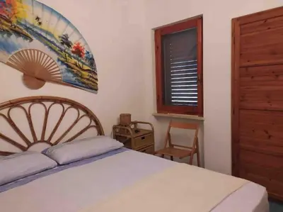 Letto o letti in una camera di Cala Pira beach house