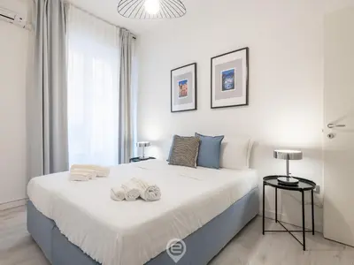 Letto o letti in una camera di Garibaldi Central Apartment