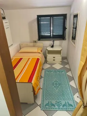 Letto o letti in una camera di Casa Mary, vero relax a 15 min. dal mare-IUN Q1172