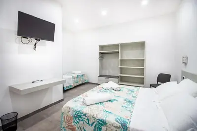 Letto o letti in una camera di S'Omu e Chicchinu Rooms