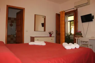 Letto o letti in una camera di Fiori e Limoni