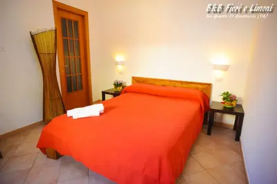 Letto o letti in una camera di Fiori e Limoni