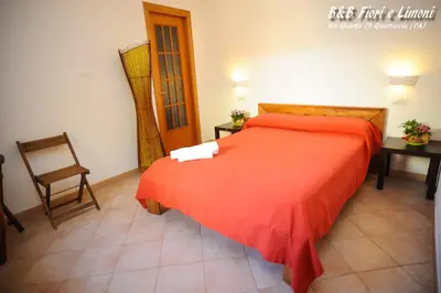 Letto o letti in una camera di Fiori e Limoni