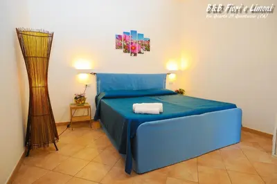 Letto o letti in una camera di Fiori e Limoni