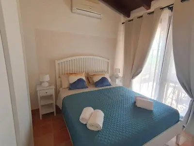 Letto o letti in una camera di Casa Evalù