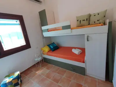 Letto o letti in una camera di Casa Evalù