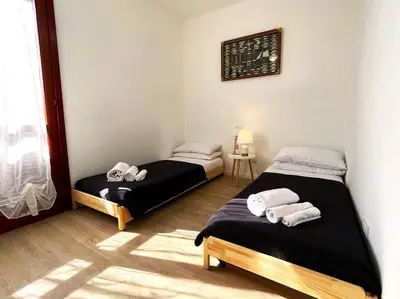 Letto o letti in una camera di Apt. MarisDomus, 300m dal Centro