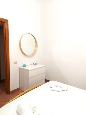 Letto o letti in una camera di Casa Gio' IUN R4246