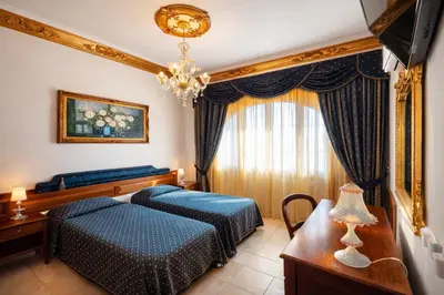 Letto o letti in una camera di Euro Hotel Iglesias