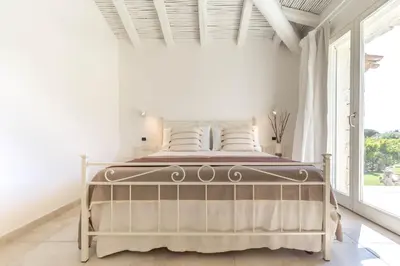 Letto o letti in una camera di Villa Mandorlo a soli 500 mt dal mare con piscina privata e vista mare