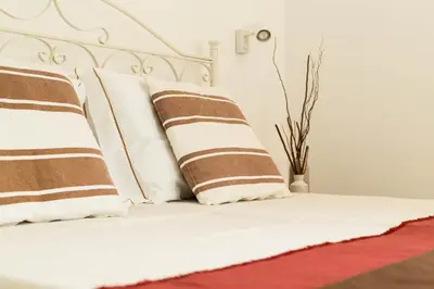 Letto o letti in una camera di Villa Mandorlo a soli 500 mt dal mare con piscina privata e vista mare