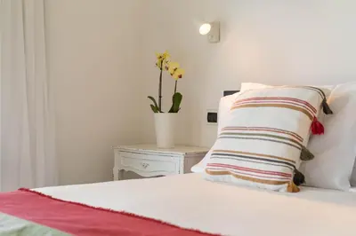 Letto o letti in una camera di Villa Mandorlo a soli 500 mt dal mare con piscina privata e vista mare