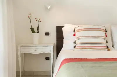 Letto o letti in una camera di Villa Mandorlo a soli 500 mt dal mare con piscina privata e vista mare