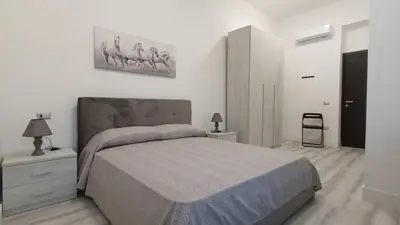 Letto o letti in una camera di La Laguna Rooms