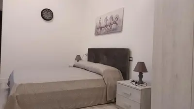 Letto o letti in una camera di La Laguna Rooms