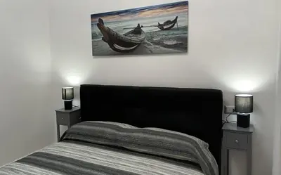 Letto o letti in una camera di La Laguna Rooms