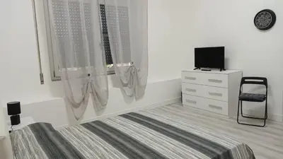 Letto o letti in una camera di La Laguna Rooms