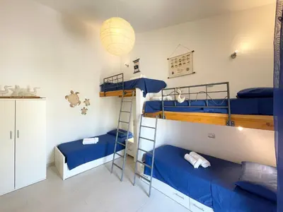 Letto o letti in una camera di Sa Pibira - 2 Bagni, 2 Camere e 6 Posti Letto
