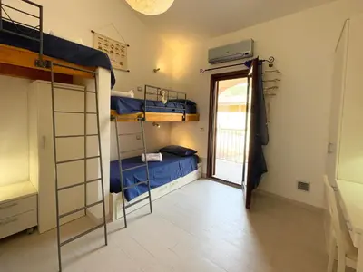 Letto o letti in una camera di Sa Pibira - 2 Bagni, 2 Camere e 6 Posti Letto