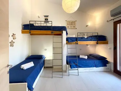 Letto o letti in una camera di Sa Pibira - 2 Bagni, 2 Camere e 6 Posti Letto