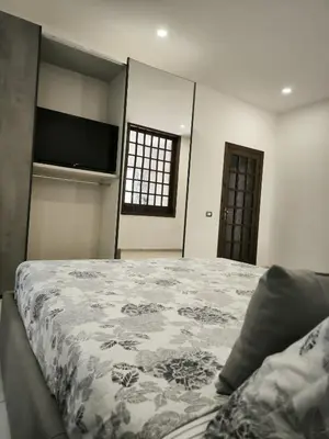 Letto o letti in una camera di Bidda Mores Appartamenti- I Velieri