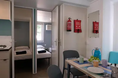 Letto o letti in una camera di Happy Camp Mobile Homes in Camping Iscrixedda