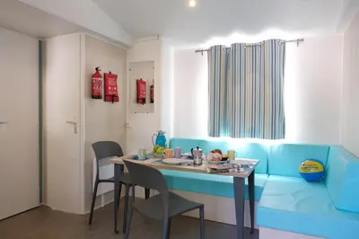Area soggiorno di Happy Camp Mobile Homes in Camping Iscrixedda