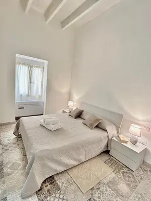 Letto o letti in una camera di Tuna House