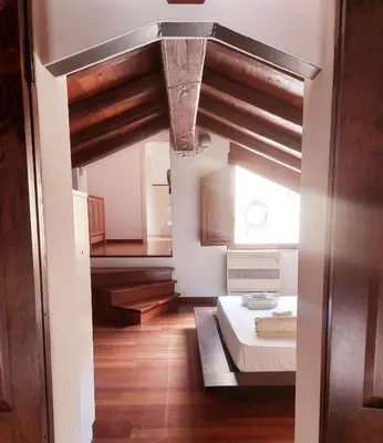 Letto o letti in una camera di Casa Ginevra