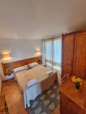 Letto o letti in una camera di Domos de Ammentos