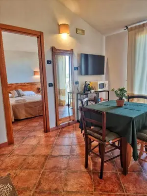 Letto o letti in una camera di Domos de Ammentos